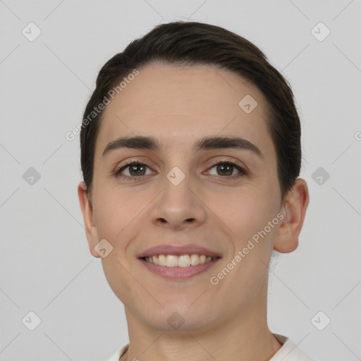 Joyful white young-adult female with short  brown hair and brown eyes