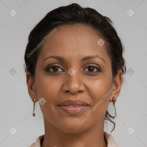 Joyful latino adult female with short  brown hair and brown eyes