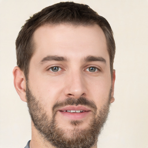 Joyful white young-adult male with short  brown hair and brown eyes