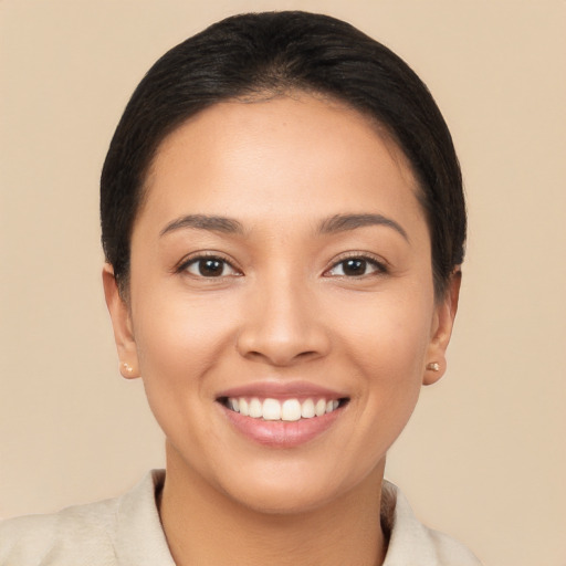 Joyful white young-adult female with short  black hair and brown eyes