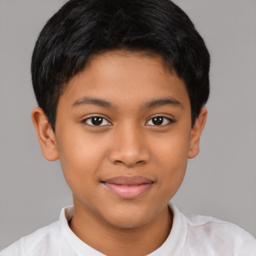 Joyful latino child male with short  brown hair and brown eyes