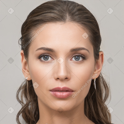 Neutral white young-adult female with long  brown hair and brown eyes