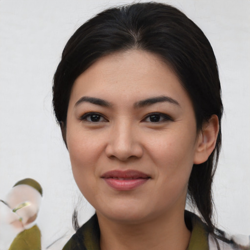 Joyful asian young-adult female with medium  black hair and brown eyes