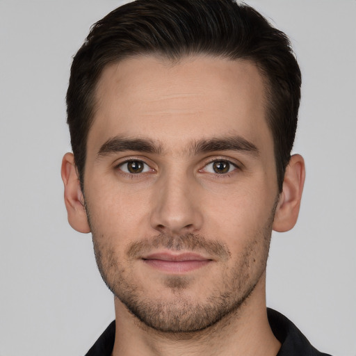 Joyful white young-adult male with short  brown hair and brown eyes