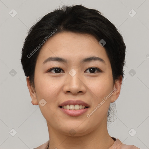 Joyful asian young-adult female with short  black hair and brown eyes