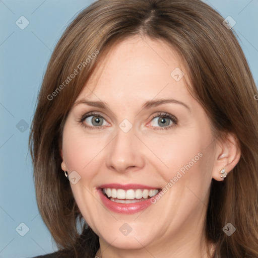 Joyful white adult female with medium  brown hair and grey eyes