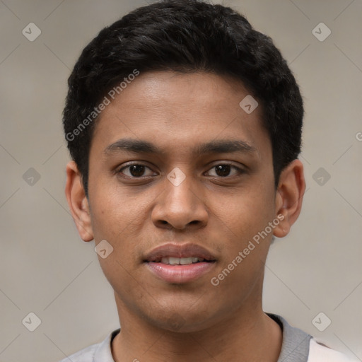 Joyful white young-adult male with short  black hair and brown eyes