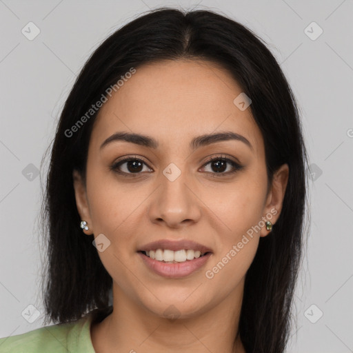 Joyful latino young-adult female with long  brown hair and brown eyes