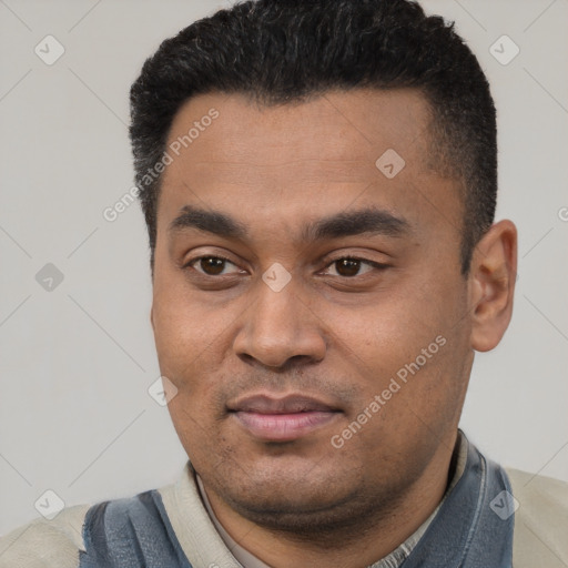 Joyful latino young-adult male with short  black hair and brown eyes