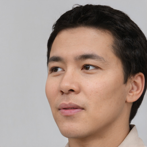 Neutral asian young-adult male with short  black hair and brown eyes