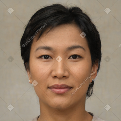 Joyful asian young-adult female with short  black hair and brown eyes