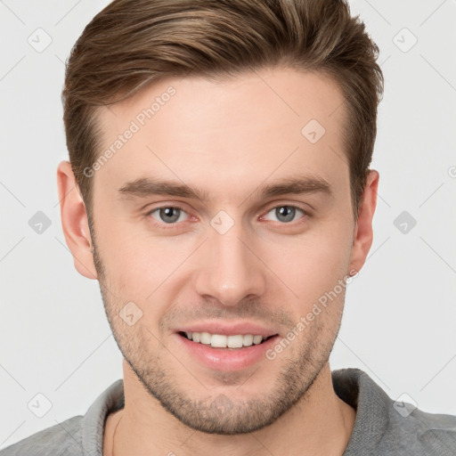 Joyful white young-adult male with short  brown hair and grey eyes