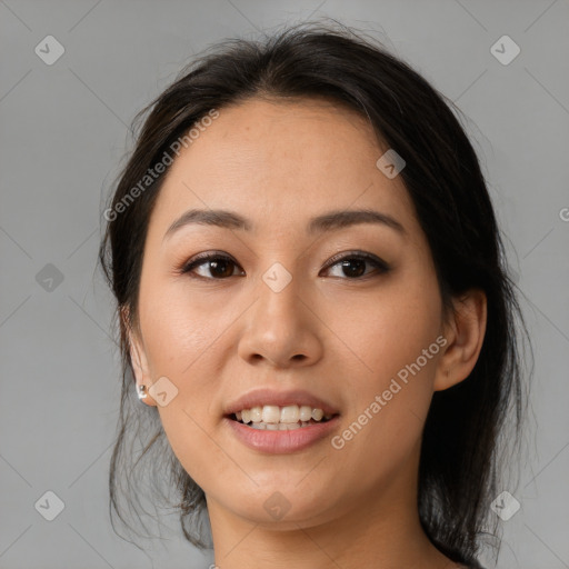 Joyful asian young-adult female with medium  brown hair and brown eyes