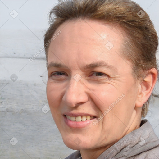 Joyful white adult female with short  brown hair and brown eyes