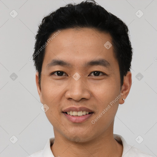 Joyful asian young-adult male with short  black hair and brown eyes