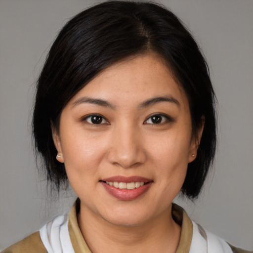 Joyful white young-adult female with medium  brown hair and brown eyes