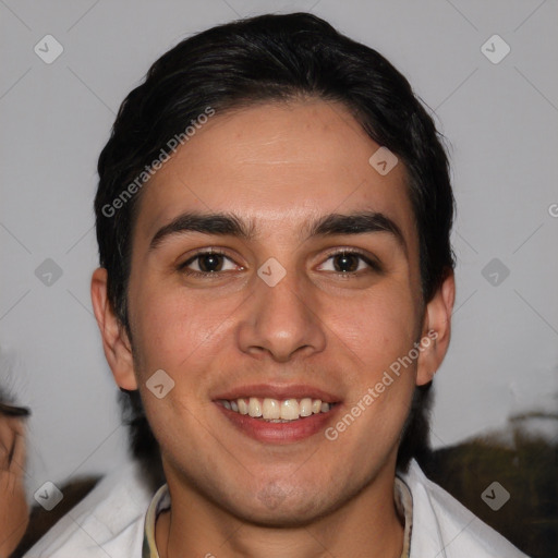 Joyful white young-adult male with short  black hair and brown eyes