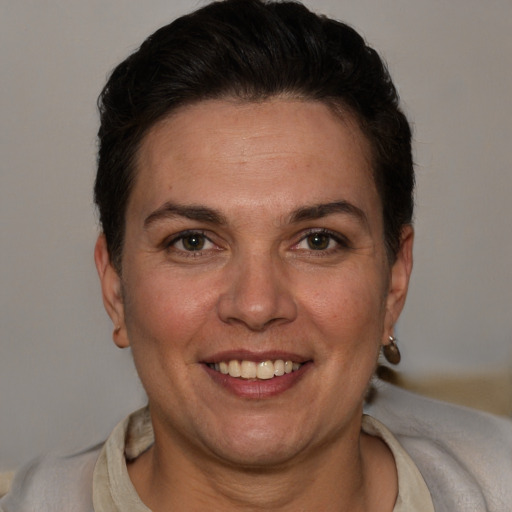 Joyful white adult female with short  brown hair and brown eyes