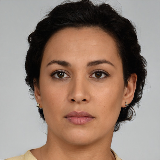 Neutral latino young-adult female with medium  brown hair and brown eyes