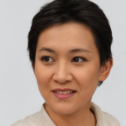 Joyful asian young-adult female with short  brown hair and brown eyes