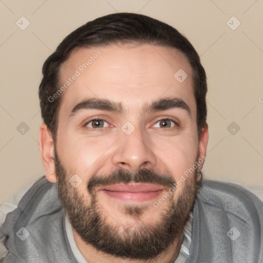 Joyful white young-adult male with short  black hair and brown eyes