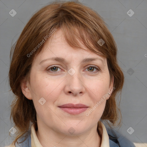 Joyful white adult female with medium  brown hair and grey eyes