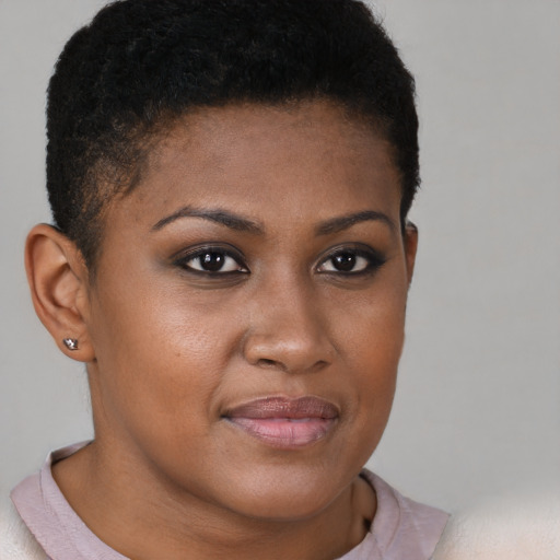 Joyful black young-adult female with short  brown hair and brown eyes