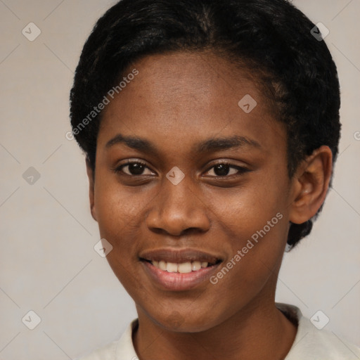 Joyful black young-adult female with short  black hair and brown eyes