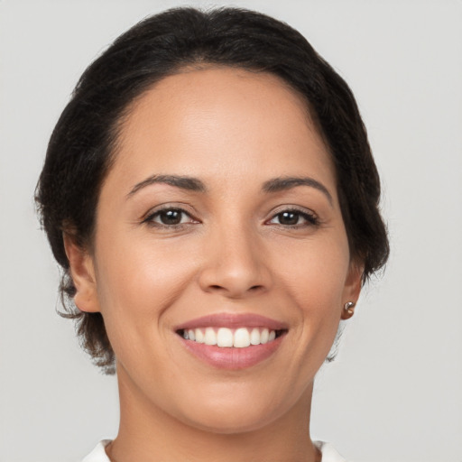 Joyful white young-adult female with medium  brown hair and brown eyes