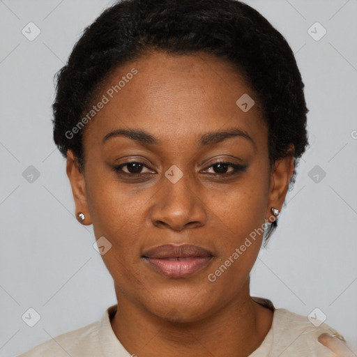 Joyful black adult female with short  black hair and brown eyes