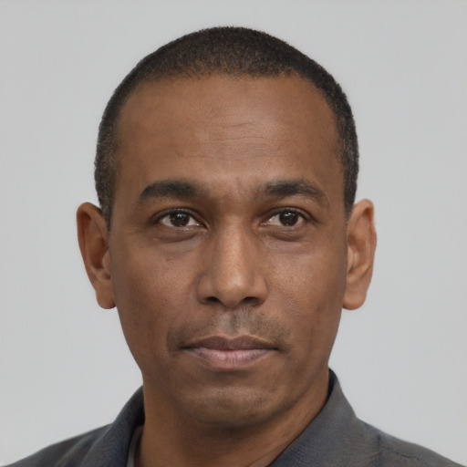 Neutral latino adult male with short  black hair and brown eyes