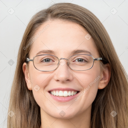 Joyful white adult female with long  brown hair and grey eyes