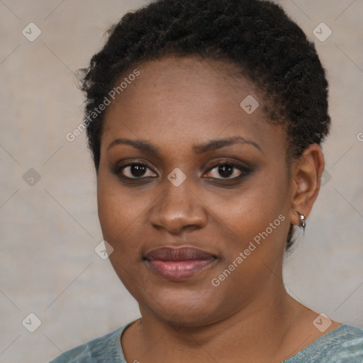 Joyful black young-adult female with short  brown hair and brown eyes