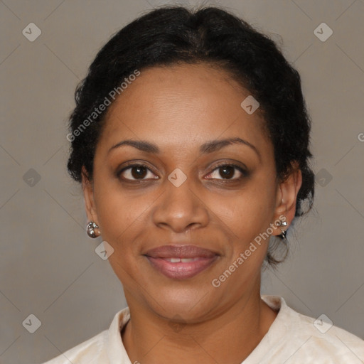 Joyful black adult female with medium  brown hair and brown eyes