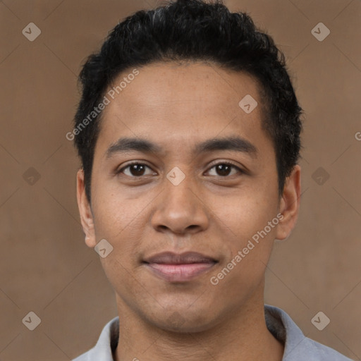 Joyful latino young-adult male with short  black hair and brown eyes