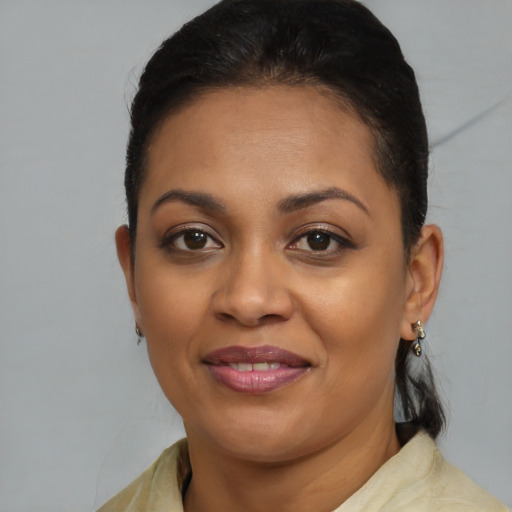 Joyful black young-adult female with medium  brown hair and brown eyes