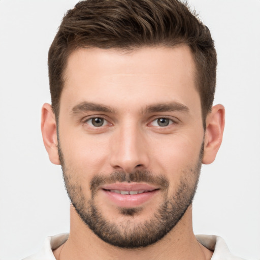 Joyful white young-adult male with short  brown hair and brown eyes