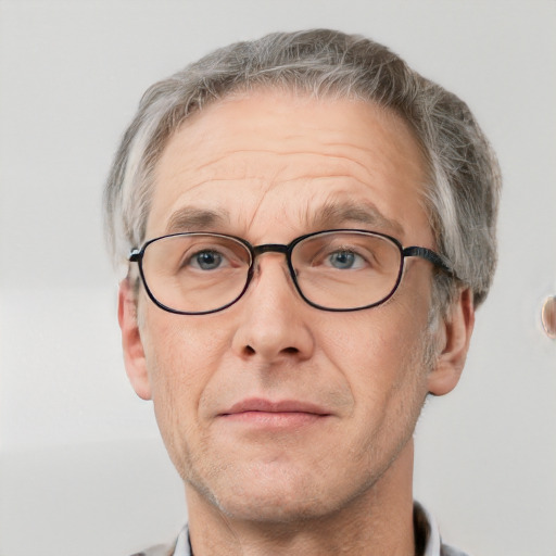 Neutral white middle-aged male with short  gray hair and grey eyes