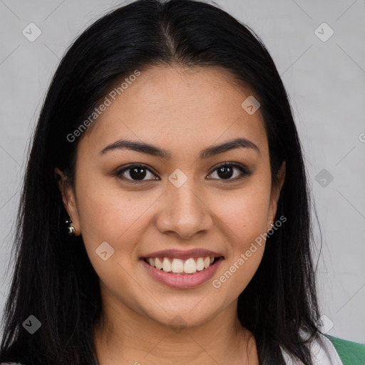 Joyful latino young-adult female with long  brown hair and brown eyes