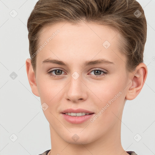 Joyful white young-adult female with short  brown hair and grey eyes