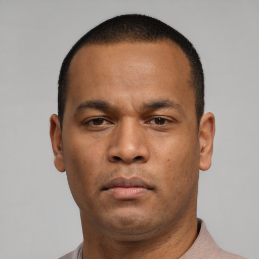 Neutral latino young-adult male with short  brown hair and brown eyes