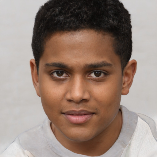 Joyful black young-adult male with short  brown hair and brown eyes