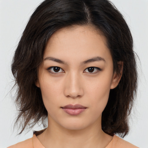 Neutral asian young-adult female with medium  brown hair and brown eyes