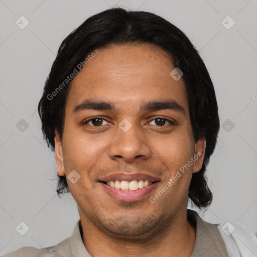 Joyful latino young-adult male with short  black hair and brown eyes