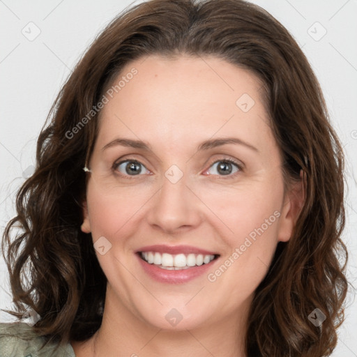 Joyful white young-adult female with long  brown hair and blue eyes