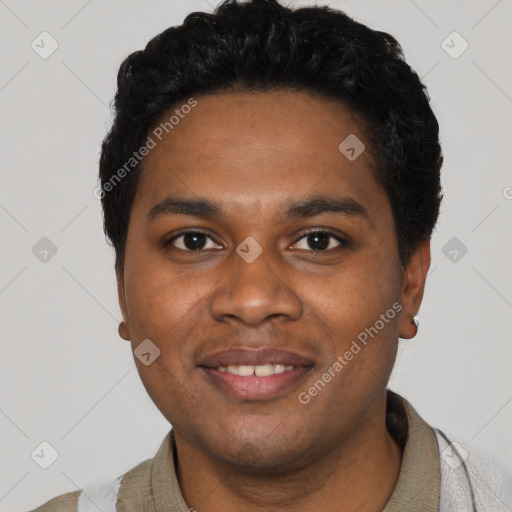 Joyful black young-adult male with short  black hair and brown eyes