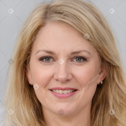 Joyful white adult female with long  brown hair and brown eyes