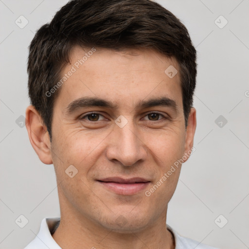 Joyful white adult male with short  brown hair and brown eyes