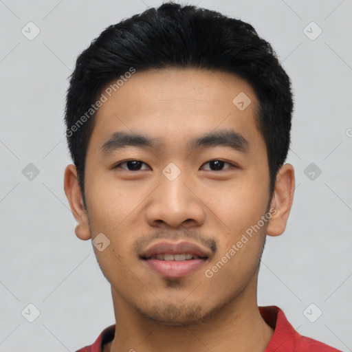 Joyful asian young-adult male with short  black hair and brown eyes