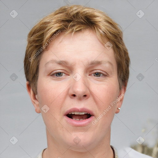 Joyful white adult female with short  brown hair and grey eyes